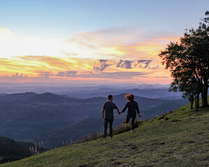Fototapeta premium couple walking in the sunset