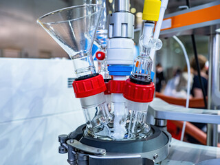 Fragment of laboratory equipment with glass elements. Device in chemical laboratory close-up. Glass...