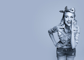 Portrait of beautiful happy smiling woman in pin up style. Blond girl posing in retro fashion and vintage concept. Black and white. Copy space.