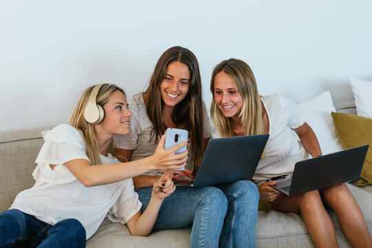 Woman showing video to positive friends