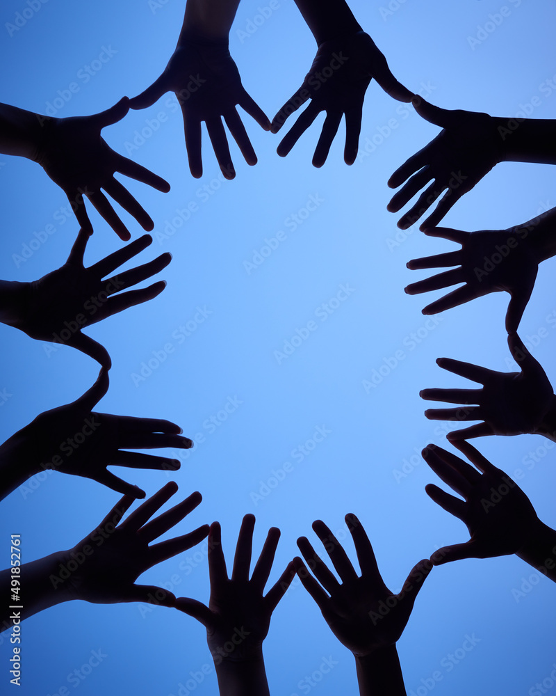 Aufkleber gather your hands around. shot of a group of hands spread out together in a circle.