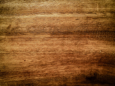 Wooden texture background in faded style. Dark brown timber is empty for creating design. Close up of plank hardwood table floor with natural pattern