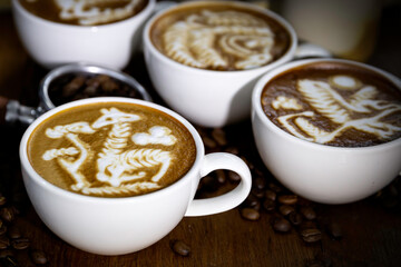 cup of coffee latte art in barista hand.