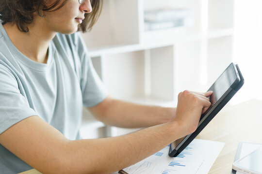 Distance education concept, Teen boy checking schedule class and studying online on tablet at home