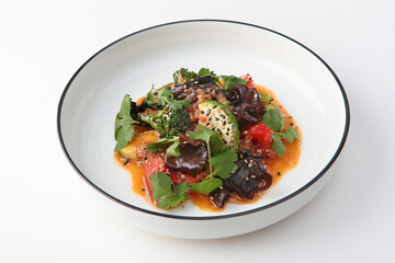 Salad with grilled zucchini and woody black muer mushrooms. Healthy food. Isolated object. White background.Copy space.