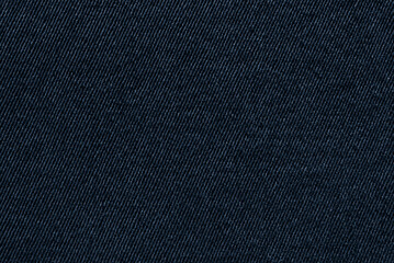 Dark blue twill cotton fabric pattern close up as background