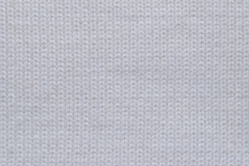 Fototapeta na wymiar White knit fabric pattern as background