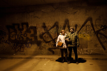 Older couple hiding from war in a underground shelter