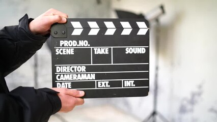 Clapperboard numbering man's hands close up