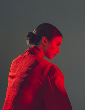 Portrait of a stylish girl in fashionable clothes with makeup in the studio