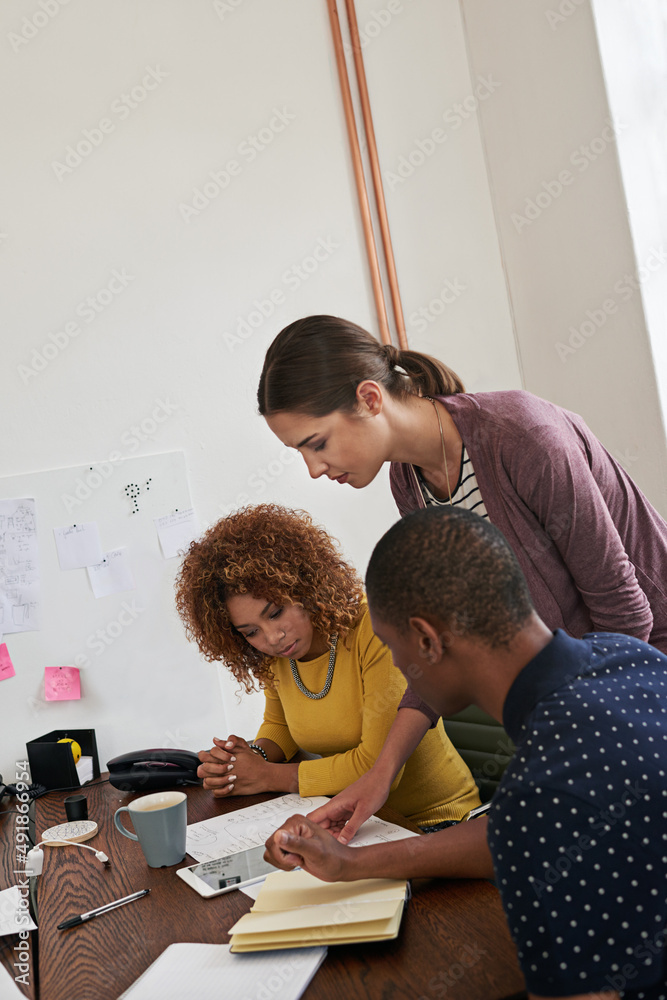 Poster id like to give this more attention. shot of a group of colleagues having a meeting in a modern offi