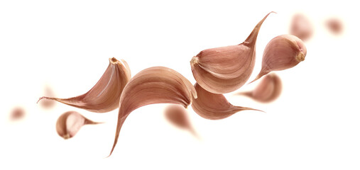 Garlic cloves levitate on a white background