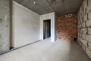 new apartment in rough finish. Brick wall. Housing stock concept. Real estate object