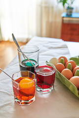 preparation for the Easter holiday, coloring eggs at home, tissue with spoons