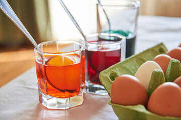 preparation for the Easter holiday, coloring eggs at home, tissue with spoons