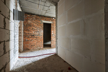 new apartment in rough finish. Brick wall. Housing stock concept. Real estate object
