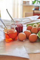 preparation for the Easter holiday, coloring eggs at home, tissue with spoons