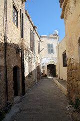 Fototapeta na wymiar Old alley to the Carob House in Kyrenia, Northern Cyprus