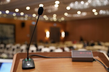 Speaker Microphone in Conference Hall and Blurred Background