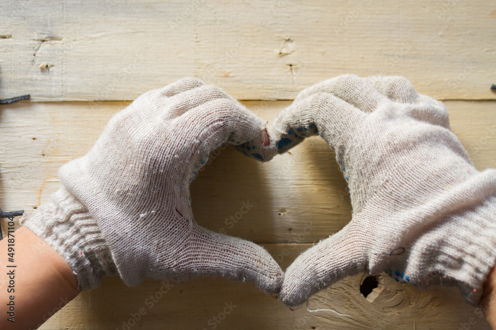 Wall mural Hand in work gloves