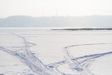 Snowmobile track marks on the snow
