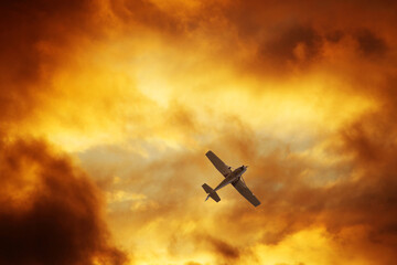 Airplane in the dramatic sky