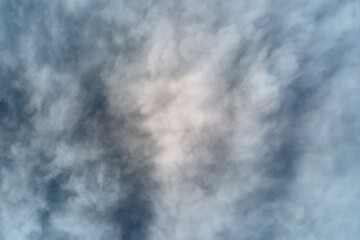 Aerial view from high altitude of earth covered with puffy rainy clouds forming before rainstorm