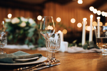 Empty wine glasses on a wooden table. Table decoration for a festive dinner