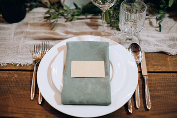 Beautiful table setting on a wooden table in restaurant