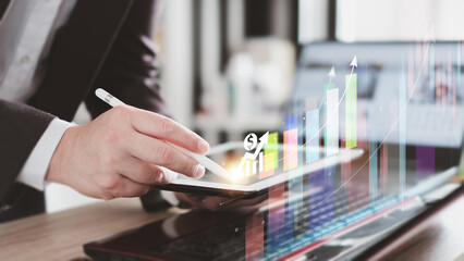 Businessman analyzes profitability of working companies with digital augmented reality graphic, positive indicators businessman calculates financial data for long-term investmens. virtual screen Graph