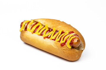 Hot dog with ketchup and mustard on white isolated background.