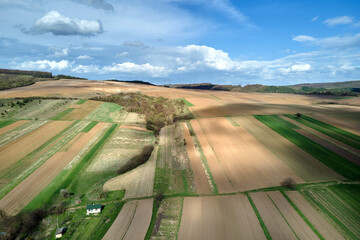 Aerial view of plowed agricultural fields with cultivated fertile soil prepared for planting crops...