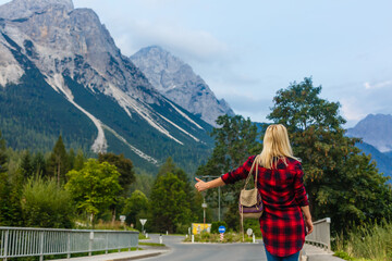 Fototapeta na wymiar A woman looking at the mountains. Europe, Germany, Bavaria