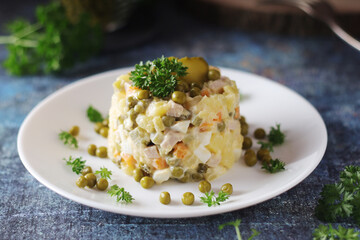 Olivier salad, traditional Russian dish, served on the plate