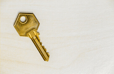 Old golden retro house key, property business, real estate background