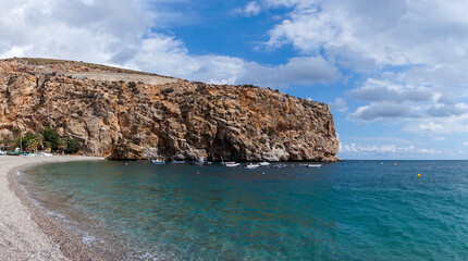 Fototapeta na wymiar panorama view of Calahonda beach with cliffs and colorful fishing boats