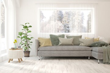 White living room with sofa and winter landscape in window. Scandinavian interior design. 3D illustration