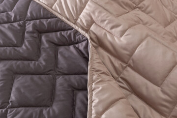 Structural voluminous blanket.  Texture of two-tone quilt