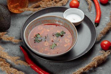 Traditional russian Solyanka or saltwort soup. Selective focus. photo for the menu, traditional food