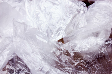 Plastic bags close-up. Hand and plastic bags. Transparent plastic bags.