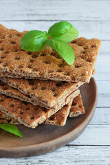 Crackers with a high fiber content, buckwheat crackers in a clay plate.Crispy buckwheat bread.Healthy eating.