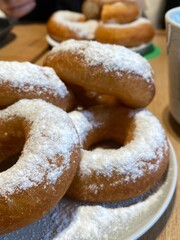 Donuts with sugar powder. Sweet classic donut close up. Dessert at the cafe. Lifestyle photo with...