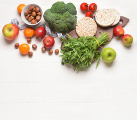 Composition with healthy natural products on light wooden background