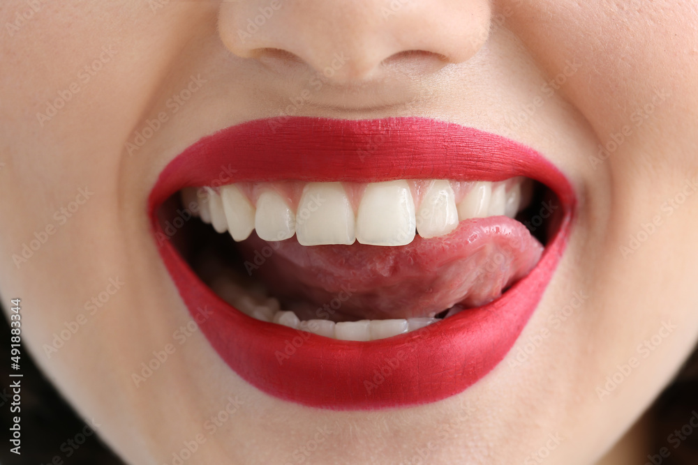 Canvas Prints Happy woman with red lips showing tongue, closeup