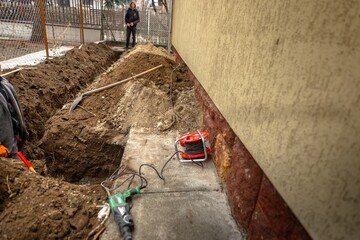 Digging up soil at the pipeline outdoors