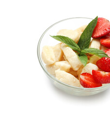 Bowl of delicious lazy dumplings with strawberry on white background, closeup