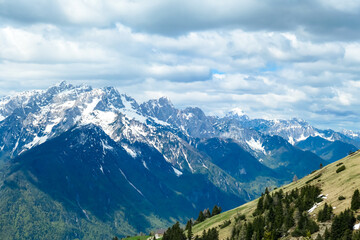 Fototapeta na wymiar Panoramic view in spring from Frauenkogel on mount Mangart in the Julian Alps, Friuli, Italy. Border Austria, Italy, Slovenia. Triglav National Park. Upper Drava valley. Summit