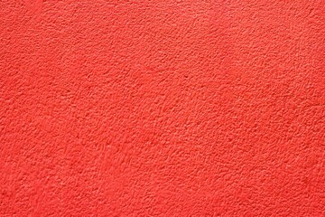 Fototapeta premium Close up rough red cement wall texture background photo 