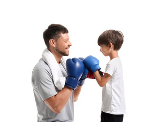 Little boy with and his boxing trainer on white background