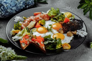 Full English breakfast with toast bread, chicken egg, mustard sauce, champignons, salad mix, cheese cream, sweet pepper